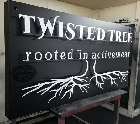 Twisted Tree Black and White Sign Curbside