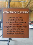 Brown communication statement hanging sign