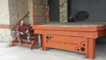 Commercial address sign with a copper finish